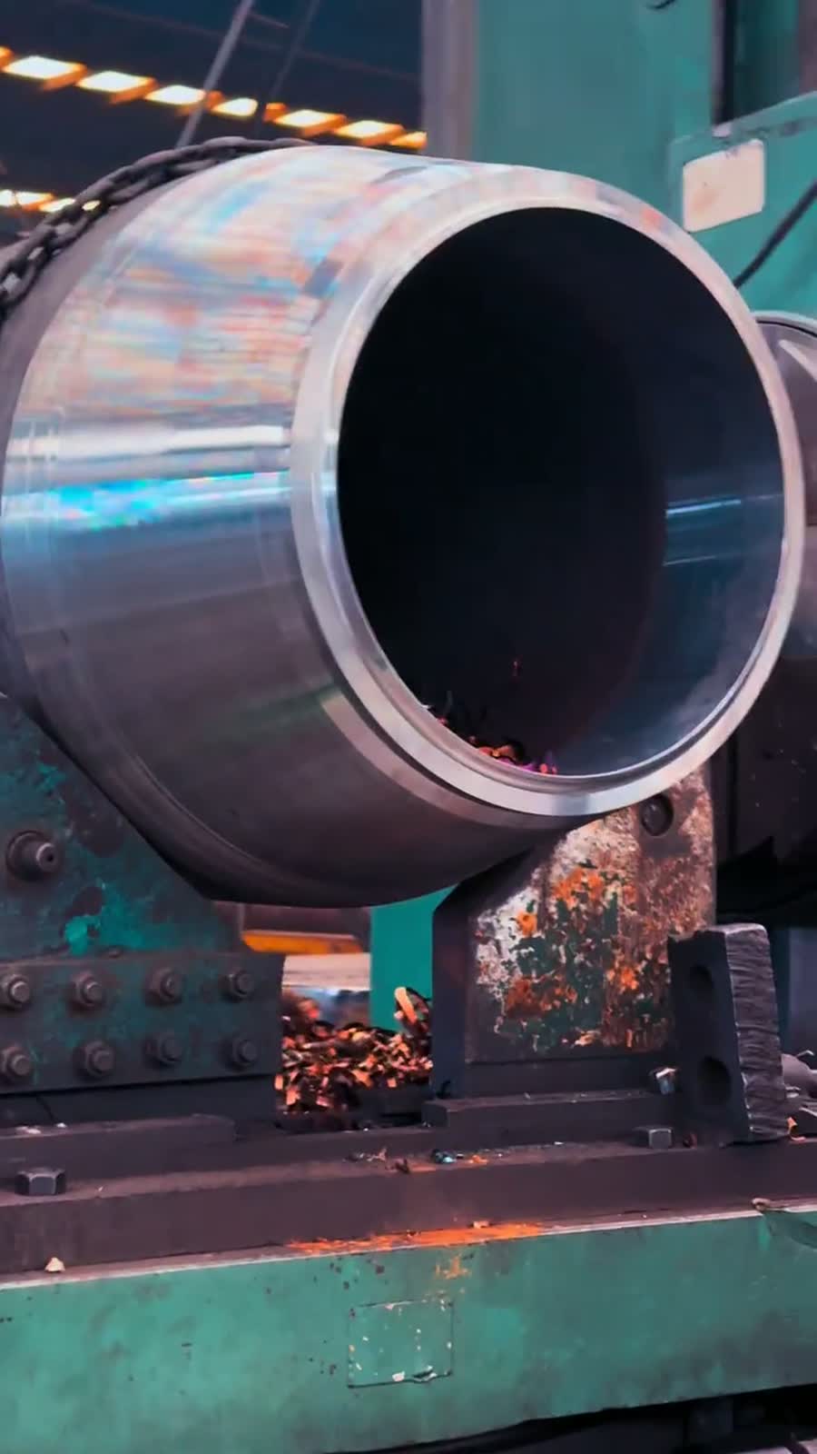 Heavy-wall pipe end being machined on the production line